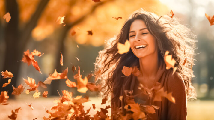 Beautiful woman and autumn leaves