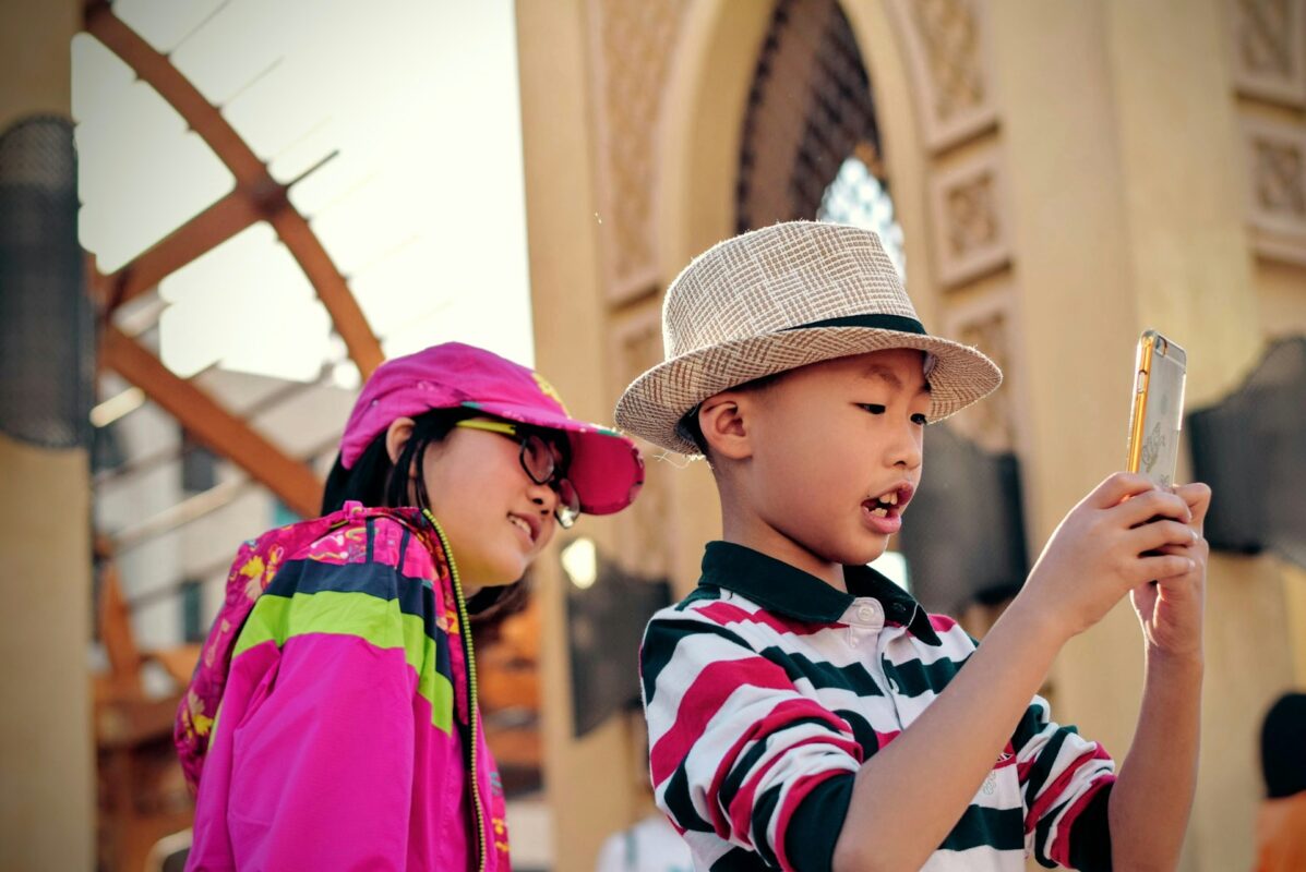 two children wearing hats on a family vacation